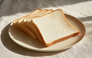 Slices of white bread neatly placed on a plate in soft daylight