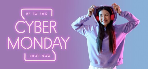 Happy young woman in hoodie on color background. Banner for Cyber Monday