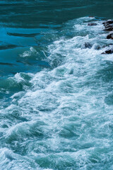 water of the stormy mountain river flowing