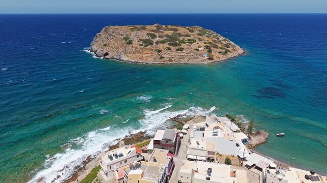 Aerial drone view of Mochlos village and island with Minoan ruins in Crete, Greece.