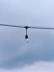 lamp and wire with blue sky background 
