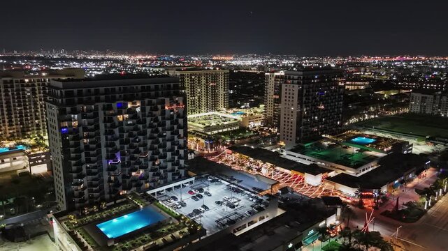 Aerial nightlife district in Doral, Florida with colorful illuminated street