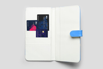 Wallet with credit cards on grey table