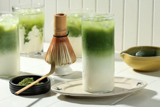 Glass of Iced Matcha Latte, Green Tea with Milk and Soy Milk.