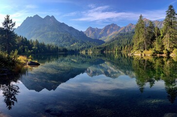Fototapeta premium Mountain lake reflection, sunrise, alpine forest, tranquility, nature poster