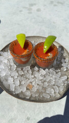 Closeup shot of Oyster Shooters in a glass on ice,