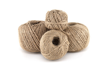 Close-up of four neatly arranged spools of natural twine, ideal for crafting and packaging.