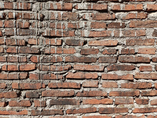 Fototapeta premium Old brick wall with peeling plaster, grunge background