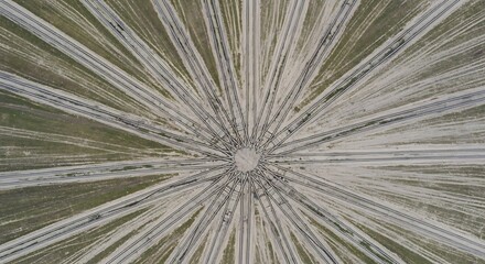 Obraz premium Aerial View of Railway Tracks Converging in a Circular Pattern, Providing a Unique Perspective