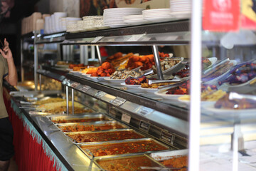 Stainless Steel Trays with Food in Kuala Lumpur Street Café