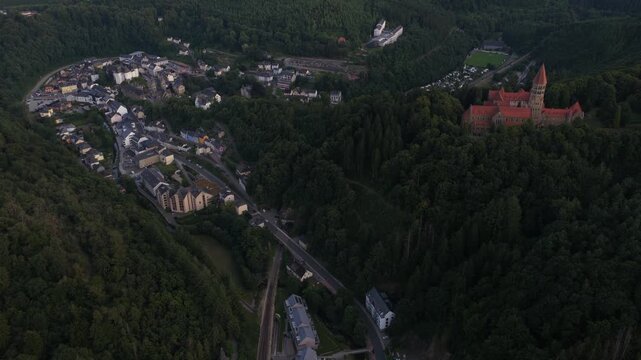 Clervaux, the Abbey of Saint Maurice and Saint Maur, plus the small mountain village setting in northern Luxembourg. Aerial view.