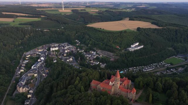 Clervaux, the Abbey of Saint Maurice and Saint Maur, plus the small mountain village setting in northern Luxembourg. Aerial view.
