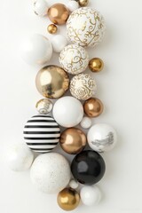 Elegant Assortment of White and Gold Decorative Spheres and Ornaments on White Background