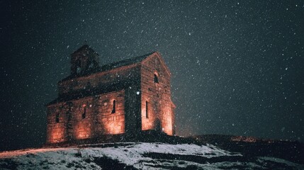 Snowy Night Scene of Vintage Stone Church Surrounded by Winter Magic