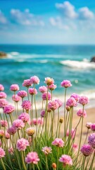 Fototapeta premium delicate pink sea thrift flowers swaying in the ocean breeze