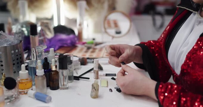 Manicure, press on and beauty with hands of person in makeup studio for growth, nail glue and salon. Cosmetics, self care and grooming with woman for acrylic extensions, polish process and pamper
