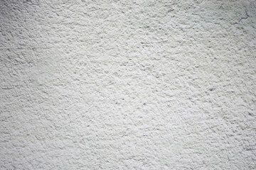 Fototapeta premium Textured white wall with subtle patterns and shadows