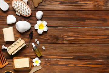 Composition with spa stones and bath accessories on wooden background