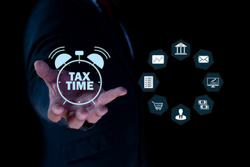 Hand supports glowing Tax Time icon. E-tax Tax payment, TAX online payment and technology concept....