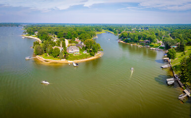 Aerial View of North Shore on Mona Lake, Norton Shores, Michigan – Scenic Peninsula with Homes and Forest” Stunning aerial drone view of the North Shore neighborhood along Mona Lake in Norton Shores, 