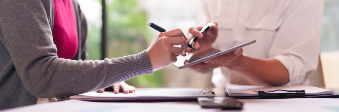 Asian adult hands business professionals collaborating digital documents tablet signing agreement office meeting modern technology - Powered by Adobe