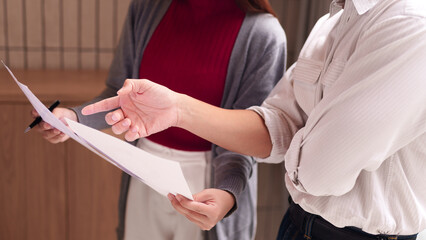 Business professionals reviewing documents discussing project reports collaboration office meeting...