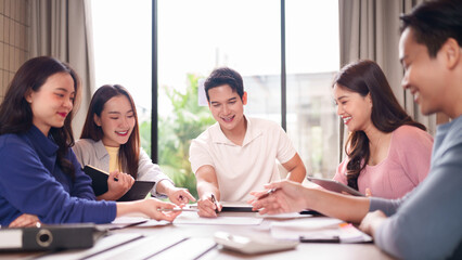 Asian young adult professionals collaborate brainstorm ideas meeting discussion new business project modern office teamwork happy colleagues productive work environment bright space
