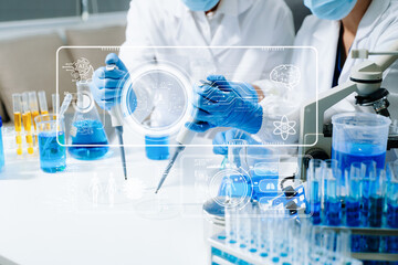 Fototapeta premium Scientists in a high tech lab conduct research with pipettes and tablets, blending medical innovation, data science, and futuristic digital healthcare technology.