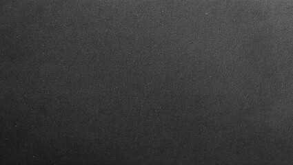 Obraz premium A simple, dark textured background ideal for graphic designs and digital presentations.