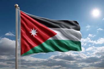 The flag of jordan waving proudly against a bright blue sky