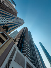 Fototapeta na wymiar Huge super tall mega buildings in Dubai, tall super structures background, building background for real estate