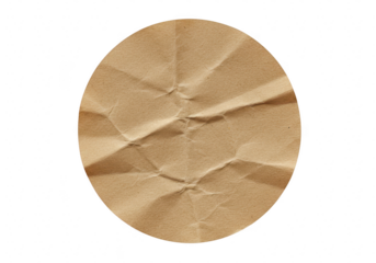 A closeup view of a crumpled piece of brown kraft paper with visible creases and textures presented in a circular shape on a transparent background