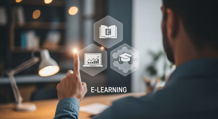 Man interacting with e learning interface on screen at desk with lamp in background indoors
