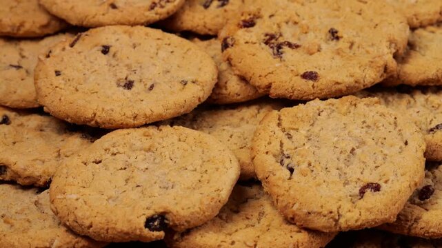 Camera moving along freshly baked oatmeal raisin cookies