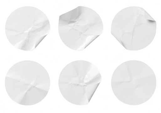 A set of six round white paper stickers with various degrees of creasing and peeling are isolated on a transparent background