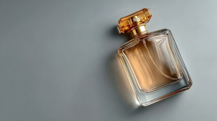 Amber Perfume Bottle on Gray Background