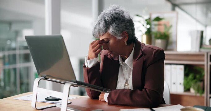 Mistake, stress or mature businesswoman on laptop for administration deadline or error report. Tired, upset or frustrated database administrator in office with tech glitch, project crisis or burnout