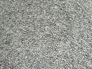 Full frame of small gray pebbles texture