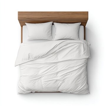 Overhead view of a made bed with light-brown headboard