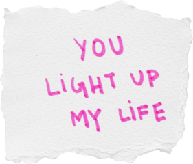 Handwritten pink text on white paper saying you light up my life with a torn edge for romantic or inspirational use