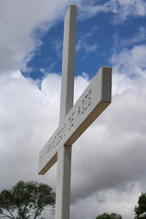 Close Up of Cross at San Francisco de Asis Spanish Catholic Mission Church in Rancho De Taos, New Mexico, the Land of Enchanment in the Southwest with Cloudy Blue Sky