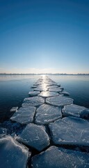 Frozen pathway across a vast body of water. Sunlight reflects on the fractured ice surface