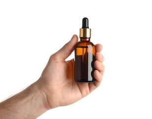 Naklejka premium Hand holding a brown glass dropper bottle