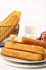 Crispy large fritters served with fresh vegetables in a cozy dining setting