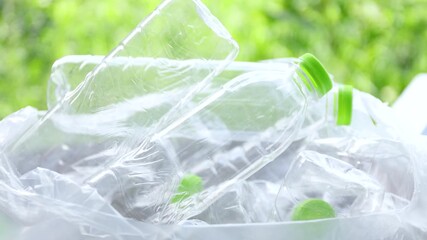 Plastic waste, Hand are plastic waste bottle and sorting it into a bag, Plastic waste recycling, Waste plastic management, and sustainable environmental care - Powered by Adobe