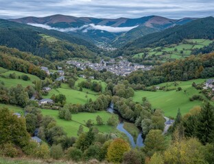 Panoramic valley view with village nestled amidst autumn foliage