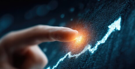 Fingertip interacts with a glowing upward trending graph displayed on a digital screen