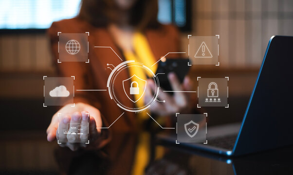 woman holding smartphone with holographic lock and data network graphics. Concept of cybersecurity, privacy, mobile protection - Powered by Adobe