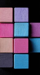 Fototapeta premium Colorful wooden blocks arranged in a grid pattern