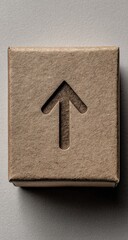 A light beige cardboard box with an embossed upward-pointing arrow
